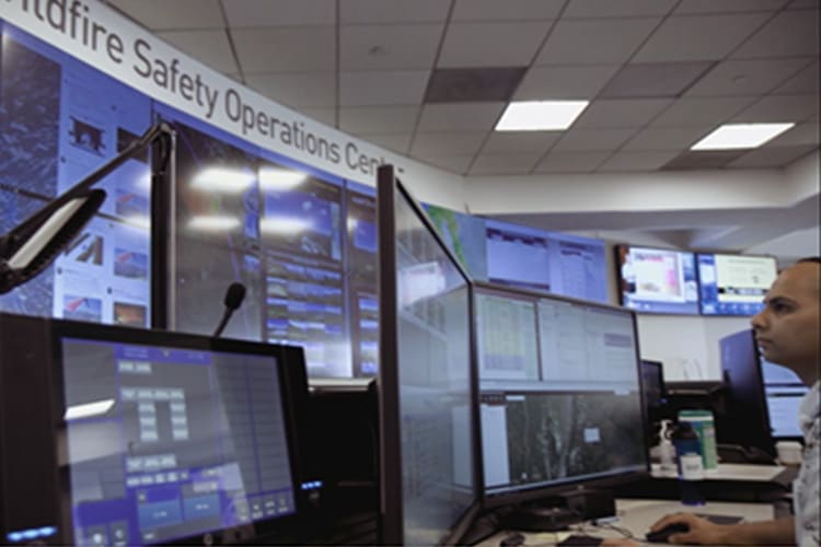 Man infront of multiple monitors