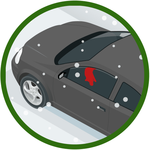 A car in the snow with a red cloth hanging outside the window.