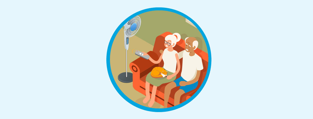 People sitting indoors with a fan
