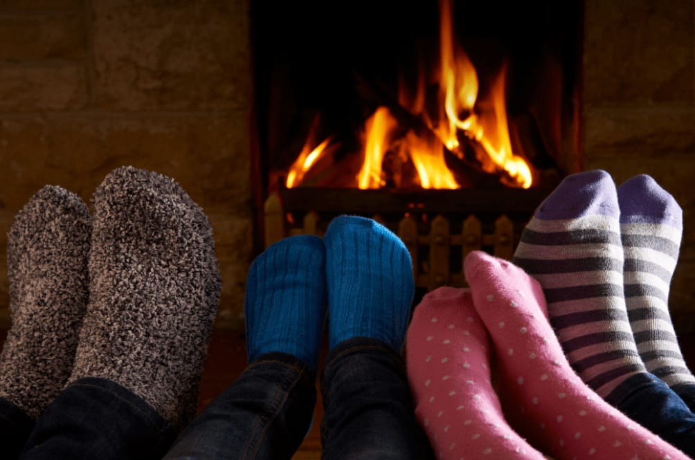 Feet warming by a fire