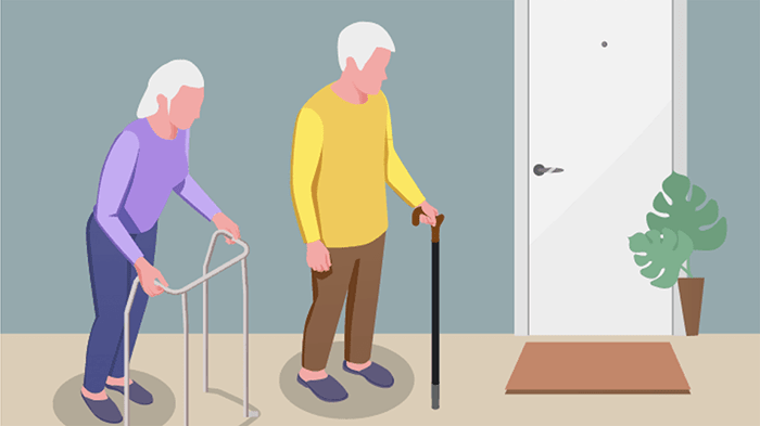 Two senior citizens with a walker and a cane